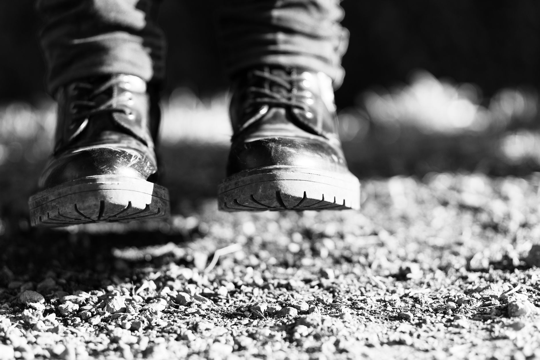 Hiking boots in boggy moorland terrain where Naismith's Rule walking estimates break down